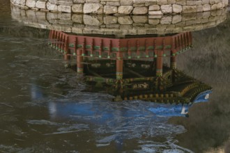 Jeongeup-si, South Korea. December 8, 2020: Reflection in water of picnic pavilion with blue roof