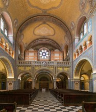 Szeged, Hungary, 14 October, 2022: view of the central nave with wooden pews and the church organ