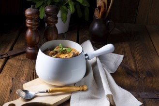 Veal goulash with baked aubergine and herbs