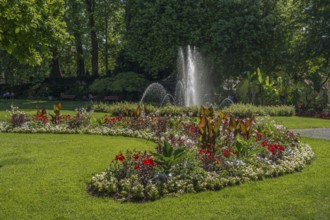 Blooming garden with impressive flower beds and bubbling fountain, meersburg, bodensee, germany