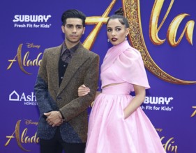 Mena Massoud and Naomi Scott at the Los Angeles premiere of 'Aladdin' held at the El Capitan
