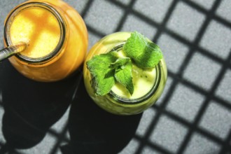 Seasonal Matcha green vegan smoothie with chia seeds and mint pumpkin carrot smoothie drink detox