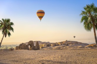 Hot air balloon over ruins of Hatshepsut temple in Luxor, Egypt, Africa