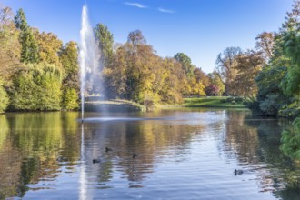 Spa garden pond with autumn trees and fountain in Wiesbaden spa garden