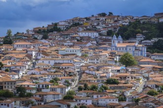 Close-up aerial view with sunshine, shadow and clouds to the historic town center of Diamantina,