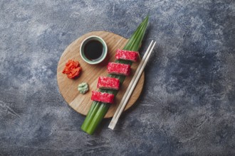 Food, Food, Sushi rolls on wooden board. Stone background. Top view