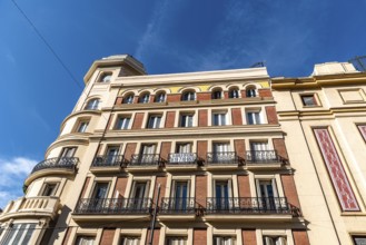 Madrid, Spain, November 1, 2020: Old residential building with iron balconies in the downtown of