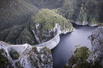View of the Gordon Dam on a cool summer's day. It is a unique double curvature concrete arch dam