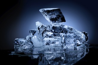 Frozen block of ice with blue tinted background