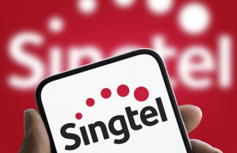 Singtel logo is displayed on smartphone. Singtel, is a Singaporean telecommunications conglomerate