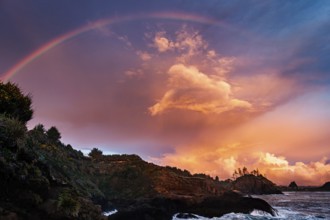 A Rainbow over a beautiful sunset at the beach, Northern California, USA, North America
