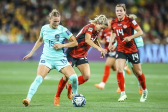 MELBOURNE, AUSTRALIA, JULY 31: Clare HUNT of Australia and Cloe LACASSE of Canada tackle as