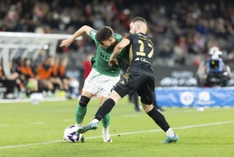MELBOURNE, AUSTRALIA, MAY 24: Ben Parkinson of Newcastle United competes with Benjamin Garuccio of