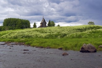 Wooden chapel on the banks of the river Keret. At this point the Keret River flows into the White