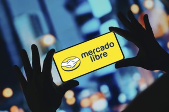 In this photo illustration, the Mercado Libre logo is displayed on a smartphone screen