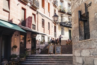 Madrid, Spain, October 11, 2020: Cozy bar in the steps of Travesia del Nuncio Street in central