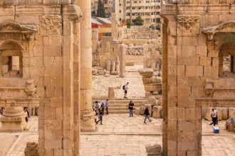 Jerash, Jordan, November 7, 2022: People visiting Gerasa ancient roman city, archs and ancient