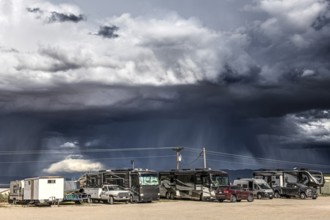 Wild thunderstorm and rain clouds over the car park of Baker, Nevada, USA, North America