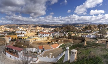 Guadix, Spain, 24 February, 2024: panorama view of the troglodyte houses in the Barrio de Santiago