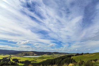 Caitlins Scenic Road. Incredible sky and clouds of summer sunset. South Island. The southernmost