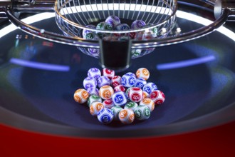 Colourful lottery balls in a rotating bingo machine