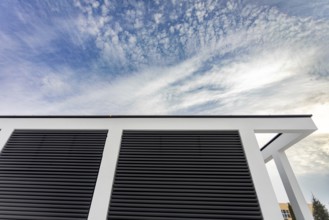 An intriguing and striking perspective captured of a buildings roof featuring unique lines set