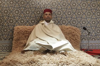 Rabat, Morocco - 29 November 2018: Koran reader sits in The Mausoleum of Mohammed V which is a