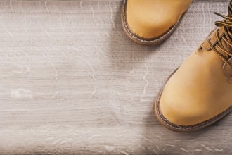 Copyspace image two working boots on wood board