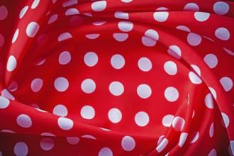 Red polka-dot fabric holidays concept