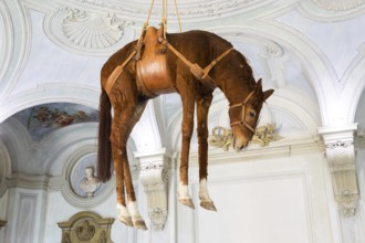 Rivoli, Italy, June 2022: Maurizio Cattelan provocative contemporary art, Novecento, Europe