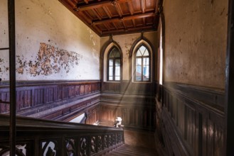 Wooden staircase in abandoned Sharovskiy Castle, Kharkov region. Ukraine