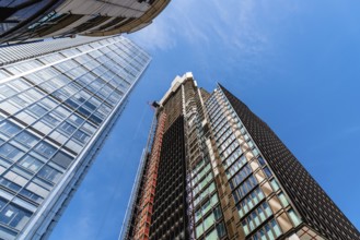 London, UK, May 14, 2019: Low angle view of office buildings under construction in the City of