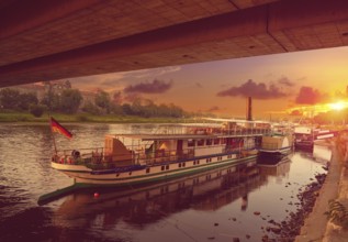 Dresden Elbe river and boats at sunset in Saxony of Germany