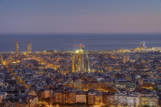 The Barcelona skyline with the famous Sagrada Familia at dusk