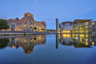 The Reichstag and the Paul Löbe House on the Spree in Berlin at dusk