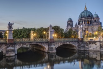 Berlin Cathedral and a bridge over the river at dusk
