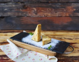 Traditional Hungarian Esterhazy cake on a wooden background