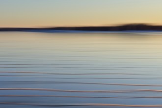 Abstract of sea covered with frozen ice at sunset in winter using ICM (Intentional camera