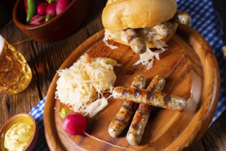 Rustic Thuringian bratwurst with sauerkraut and roll