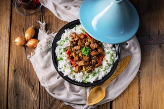 Tajin beef stew with rice, peppers and sesame seeds
