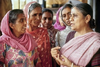 Ela Bhatt Gandhian social worker talking with members, Gujarat, India, Asia