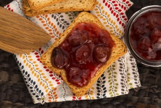 Breakfast of cherry jam on toast