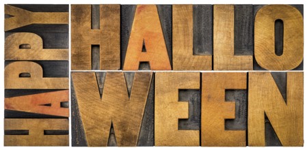 Happy Halloween banner or greeting card - isolated word abstract in vintage grunge letterpress wood