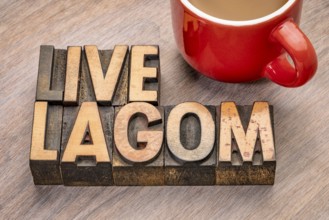 Live lagom word abstract in vintage letterpress wood type blocks, Swedish balanced lifestyle