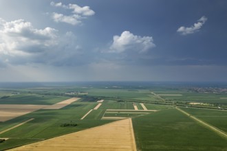 Aerial view of agricultural fields. Cloudy countryside, Aerial view