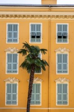 The typical facades of a traditional townhouse in Nice (Nizza), Cote d'Azur, Alpes-Maritimes, PACA,