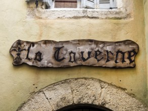 A wooden sign on a house wall in France Austria