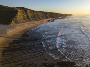 Magoito Beach and Cliffs at Sunset during Low Tide. Atlantic Ocean, Portugal. Golden Hour. Aerial
