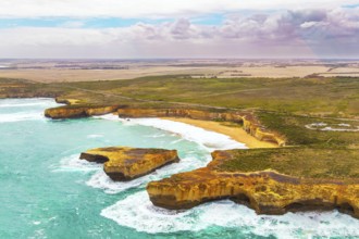 Helicopter flight over the scenic Pacific coastline. The fabulous journey to Australia. Cloudy cool