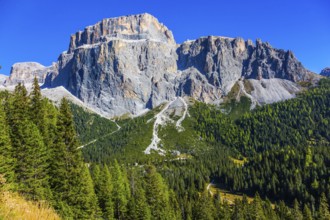 Colossal white and gray rocks against the blue sky. The most beautiful route in the Italian